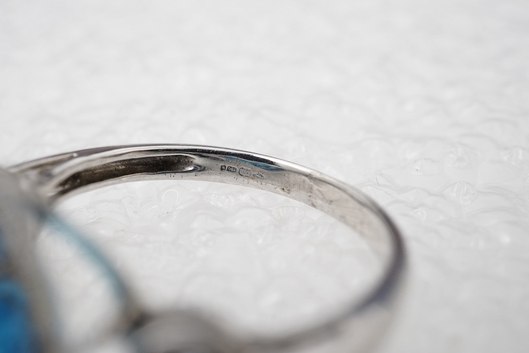 A blue topaz and diamond ring